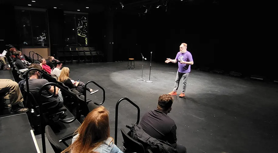 Stand-up comedy masterclass with students learning performance and writing techniques