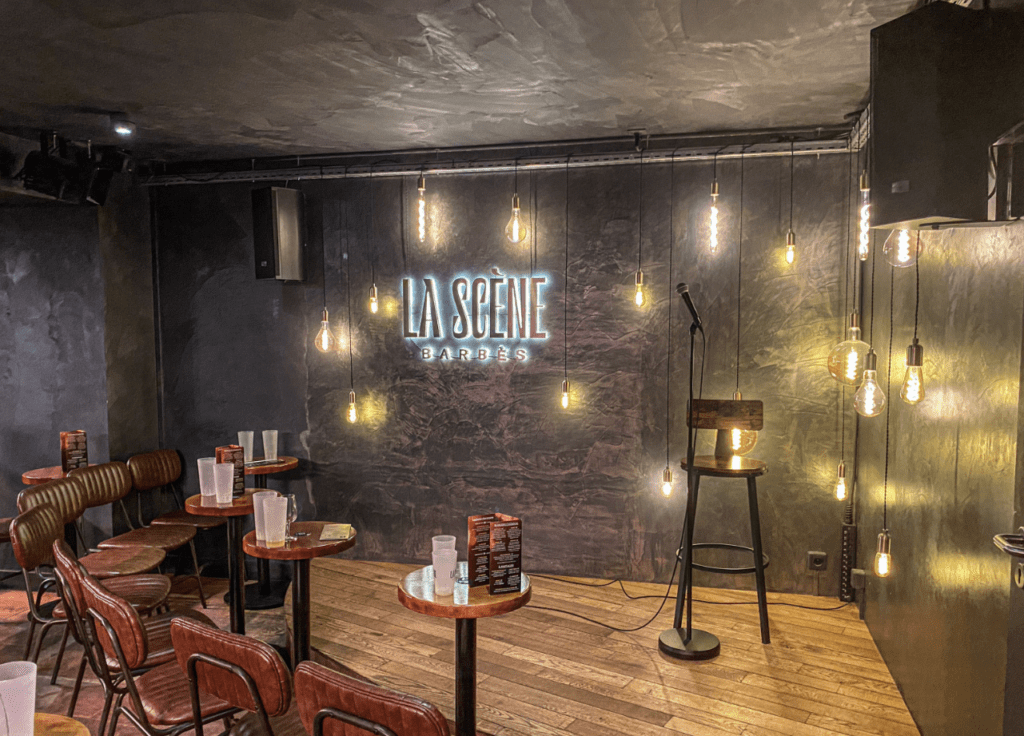 Reopening of a Paris stand-up comedy club with performers and returning audience